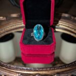 Sajen Rutilated Celestial Pariba Quartz Ring in a Red Velvet Box