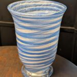 Hand-blown blue and white swirl art glass vase with footed trumpet form, alternate angle