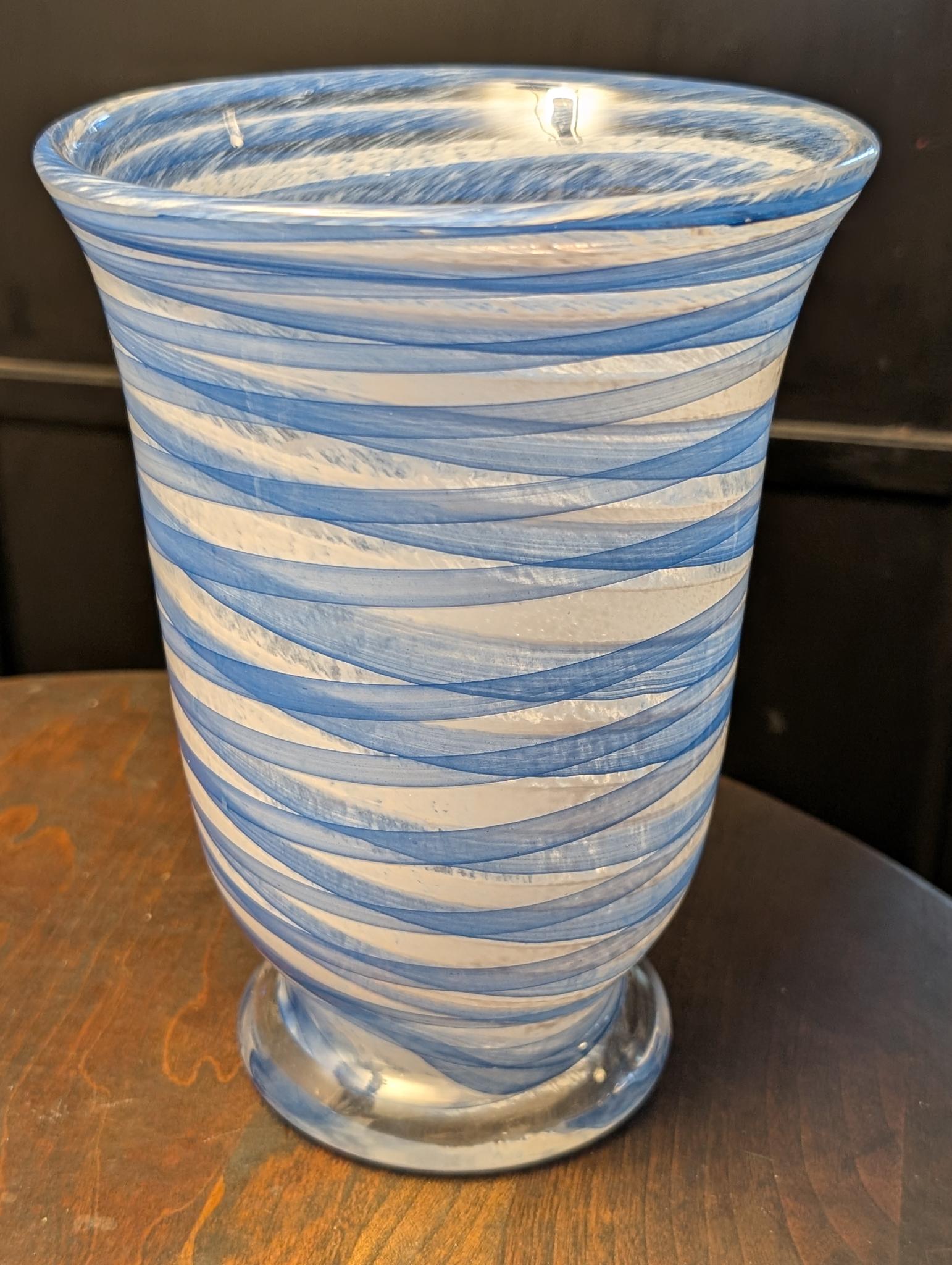 Hand-blown blue and white swirl art glass vase with footed trumpet form, front view